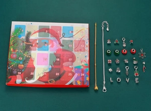 Christmas Advent calendar box with jewelry set featuring charms and festive bracelets