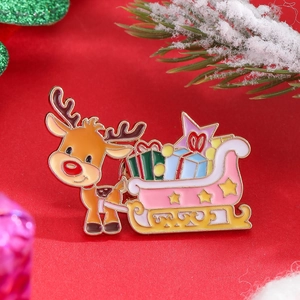 Detail of reindeer pulling pink sleigh enamel pin on festive red background