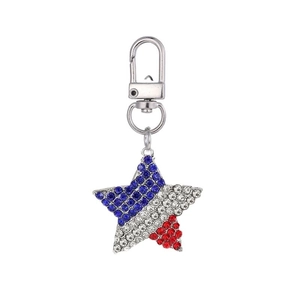 Detail of star-shaped keychain with red, white, and blue rhinestones and silver lobster clasp