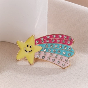 Detailed close-up of a colorful enamel star brooch with sparkling rhinestones decoration
