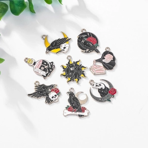 Gothic enamel skull and raven charms set in gold alloy for Halloween jewelry making
