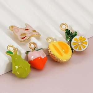 DIY charm set featuring colorful enamel fruit and fox mask pendants for jewelry making
