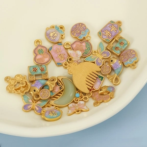 Traditional Chinese DIY charms with matte gold finish and colorful enamel koi patterns