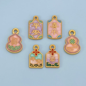 Detail of colorful enamel charms with Chinese characters and traditional patterns