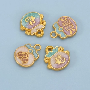 Detailed close-up of colorful enamel charms with traditional fortune and wealth symbols