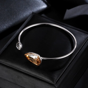 Austrian crystal open cuff bracelet with champagne pear-cut stone in a black jewelry box