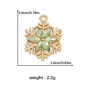 Detail of gold snowflake pendant with light green gems and measurement parameters