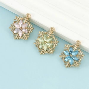 Colorful snowflake pendants in pink, green and blue for DIY jewelry making and crafts