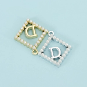 Luxe diamond-shaped letter D pendant with pearls in gold and silver finishes