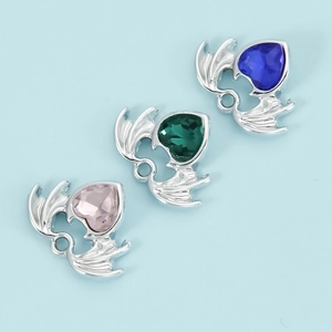 Handmade heart pendants with dragon wings and colorful gemstones for DIY jewelry design