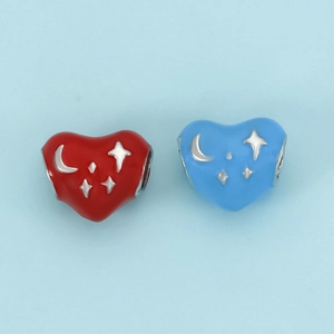 DIY heart charms with red and blue enamel featuring moon and star patterns for bracelets