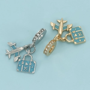 DIY travel charm with airplane and blue enamel suitcase in silver and gold plating