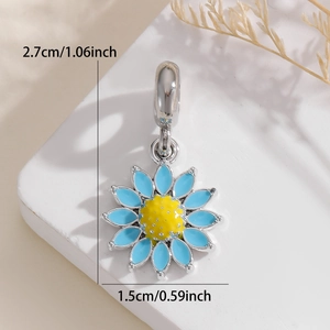 Detailed view of a sunflower charm with blue enamel petals and 2.7cm height measurements