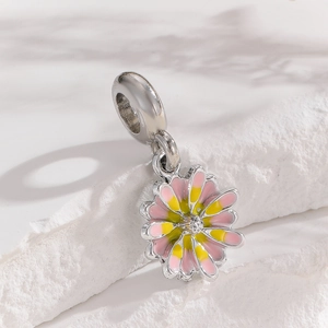Detailed view of daisy charm with pink enamel gradient and large hole bail for DIY bracelets