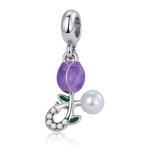 Close-up of tulip bead charm with purple enamel flower, pearl and small zircons