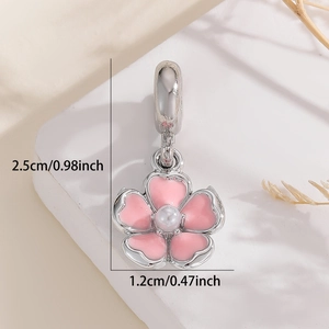 Detailed view of pink enamel cherry blossom pendant with white pearl and size dimensions