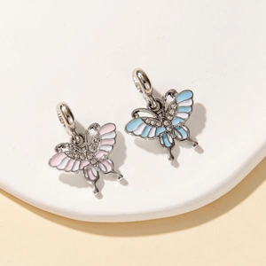 Detail of colorful butterfly pendants with enamel wings and sparkling zircon accents