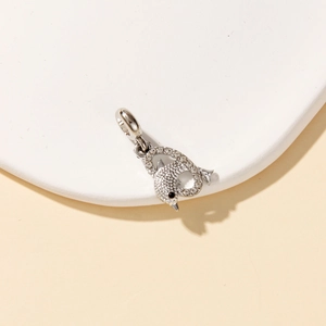 Macro view of silver dolphin pendant with sparkling rhinestones and lobster clasp