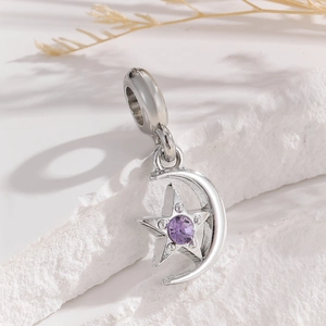 Detail of silver crescent moon and star charm with purple zircon for DIY jewelry