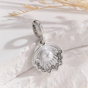 Close-up of shell pendant with pearl and cubic zirconia for DIY jewelry making