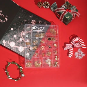 Christmas countdown jewelry advent calendar with 24 jewelry pieces in festive red box