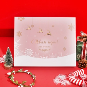 Pink Christmas advent calendar box with golden reindeer and festive holiday decorations