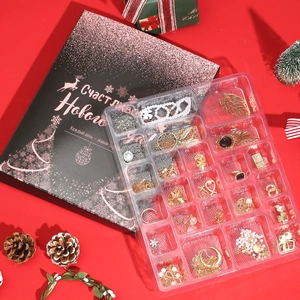 Detailed Christmas advent calendar box with 24 jewelry pieces including earrings and necklaces