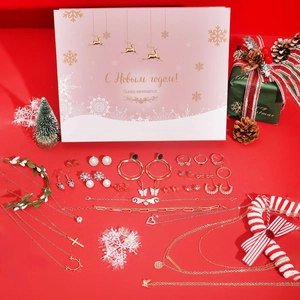 Detailed view of Christmas advent calendar jewelry set with necklaces and earrings