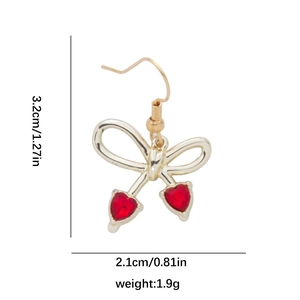 Detailed size view of gold bow earrings with red heart crystals showing dimensions