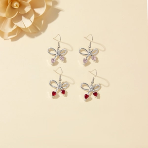 Japanese style bow earrings with pink and red heart gemstones in silver alloy finish