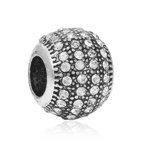 Macro detail of antique silver heart bead charm with sparkling white zircon for DIY bracelets