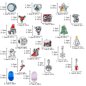 Detail of Christmas charms set including snowflakes and Santa with size dimensions