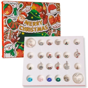 Close-up of DIY Christmas advent calendar including 22 festive charms and 2 silver bracelets