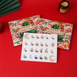 Christmas Advent Calendar with DIY beads, silver bracelets and festive charms detail