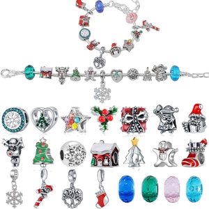 Detail view of Christmas advent calendar DIY bead set with festive charms and glass beads