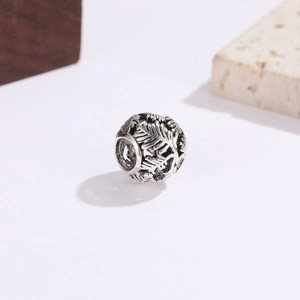 Vintage oxidized silver hollow leaf spacer bead for DIY jewelry making on a minimalist base