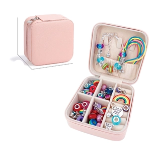 Pink portable travel jewelry organizer box for necklaces and beads in white background
