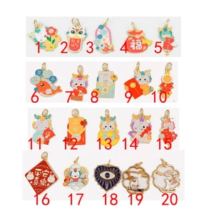 Detailed macro view of twenty assorted enamel Chinese lucky charms and zodiac pendants