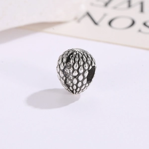 Silver dragon egg charm with scale texture and cubic zirconia for DIY jewelry making