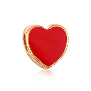 Macro view of a gold-edged red enamel heart charm for DIY beaded bracelets