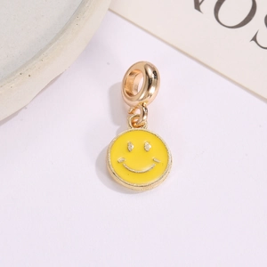 Yellow enamel smiley face charm with gold metal edges for DIY jewelry making