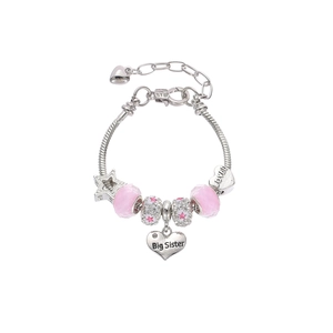 Detail of silver beaded bracelet featuring pink crystals and Big Sister heart pendant
