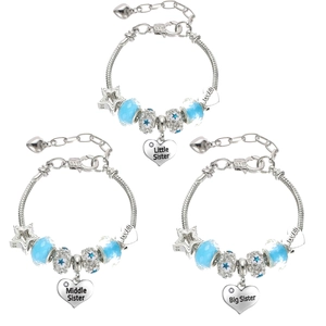 Detailed view of silver heart charms engraved with Big Middle Little Sister on blue bead bracelets