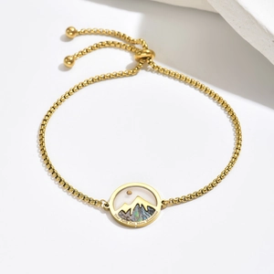 Adjustable gold chain bracelet with seashell mountain pendant and inspirational engraving