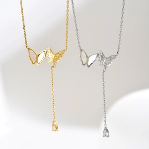 Elegante goldene und silberne Y-Schmetterlingshalsketten mit Perlmutt und Zirkon-Tropfen