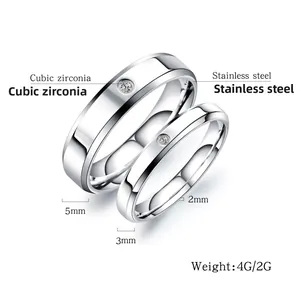 Detailed view of 5mm and 3mm silver stainless steel couple rings with cubic zirconia
