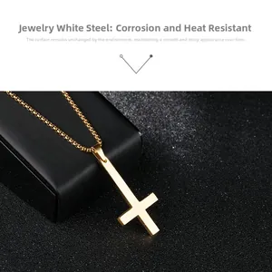 Detailed view of a polished gold-plated stainless steel cross pendant on a classic O-chain