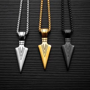Detailed view of spearhead pendant necklaces in silver, gold, and black stainless steel