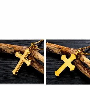 Close-up of golden triple-layer cross pendant with textured pattern on square pearl chain