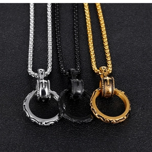 Detailed view of retro steel cross cylinder pendants in silver, black, and gold finish